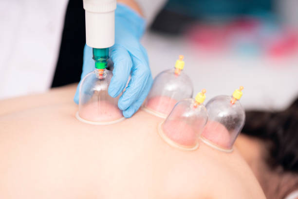 istock Female physiotherapist is examining to her patient. 1297947916