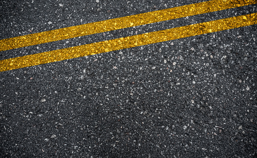 Yellow line on asphalt road