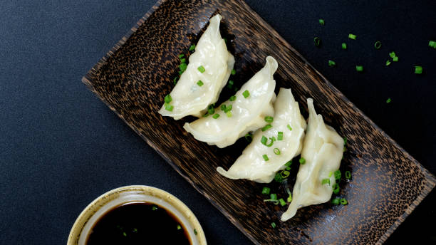 istock Gyoza dumplings with dipping sauce 1297948685