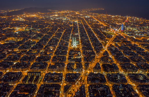 Aerial night view of Barcelona Eixample residencial district and famous basilica, Catalonia, Spain