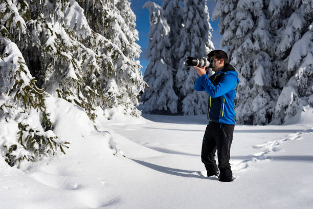 istock He likes taking photos of trees covered with snow. 1297957017