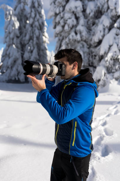 istock He likes taking photos of trees covered with snow. 1297957055