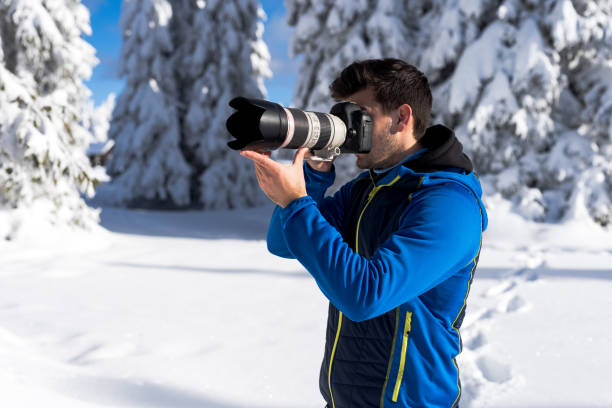 istock He likes taking photos of trees covered with snow. 1297957943
