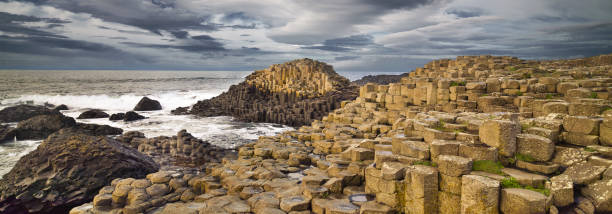 Giants Causeway rocks and ocean, autumn, Northern Ireland, UK Giants Causeway rocks and ocean, autumn. National park. Northern Ireland, UK giants causeway photos stock pictures, royalty-free photos & images