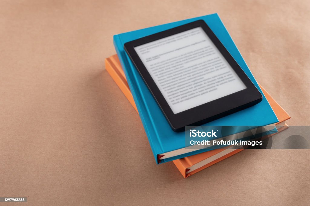 E-book reader E-book reader, stack of books E-Reader Stock Photo