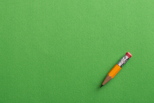 Pencil on the green background