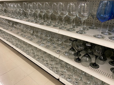 Drinking glasses on store self