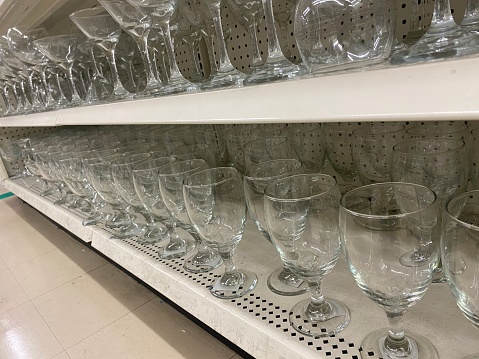 Drinking glasses on store self