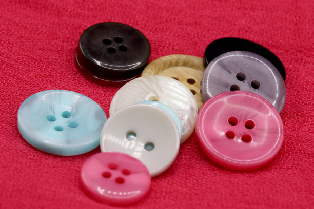 istock colorful buttons on fabric background 1297967153