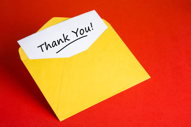 istock Yellow envelope with words THANK YOU on red background 1297967376