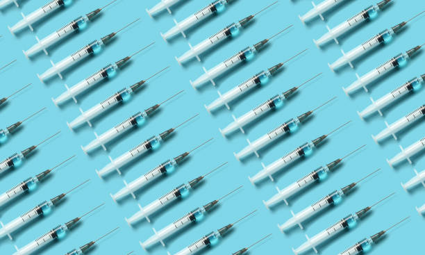 istock Medical injection syringe background 1297971613