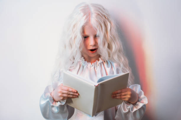istock kid curiosity amazing discovery blonde girl book 1297975008