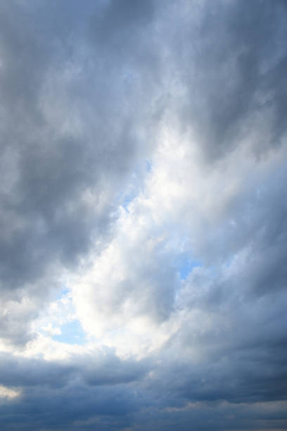 istock Stormy sky with storm clouns on the sunset with beautiful sun 1297975483