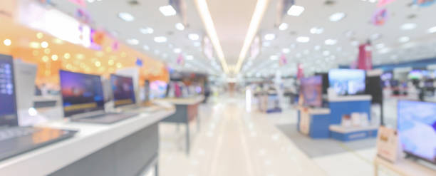 istock Laptop computer and television in electronic department store blurred background 1297978855