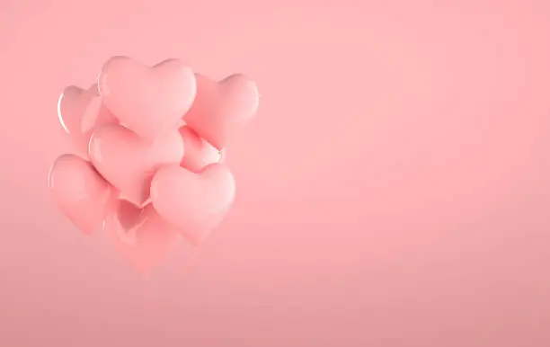 Photo of Pink glossy shiny balloons, heart shape on pastel pink background with reflection effect. Saint Valentine's day greeting card February 14 design. Love, wedding marriage ceremony celebration. 3d render