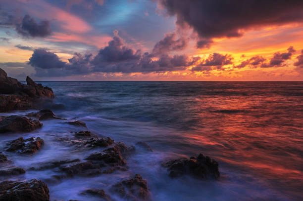 istock Tropical sunset at stones beach 1297979491