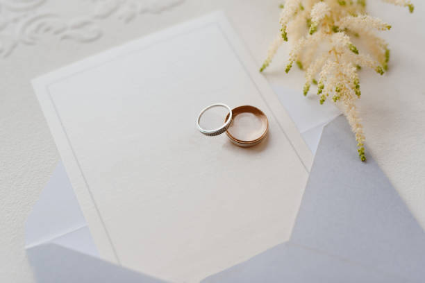 istock wedding rings with a gray wedding decoration 1297980672