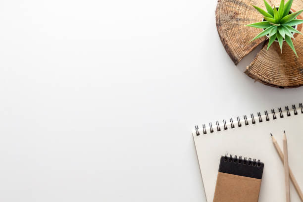istock White desk with copy space. View from above. Office supplies. An ecological workplace. 1297981256