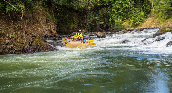 Tourists rowing on inflatable raft Costa Rica