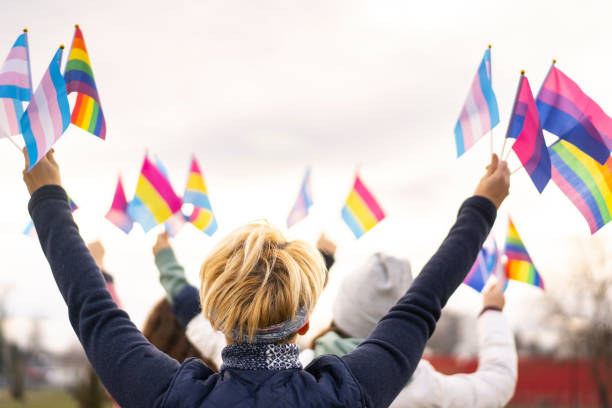 istock Diverse people on a transgender demonstration holding transgender flags 1297981851