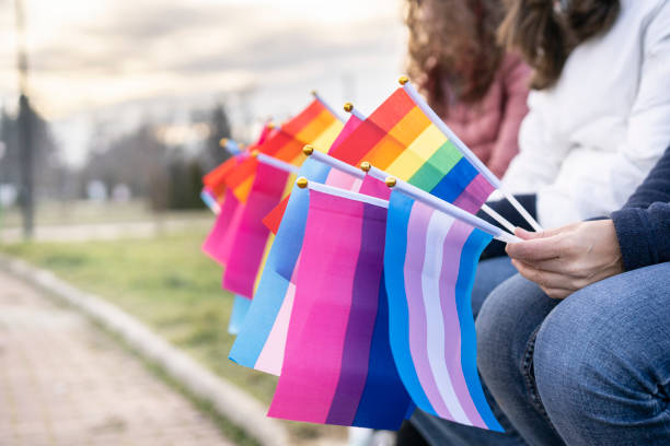 istock People waiting on an LGBTQ pride parade 1297981857