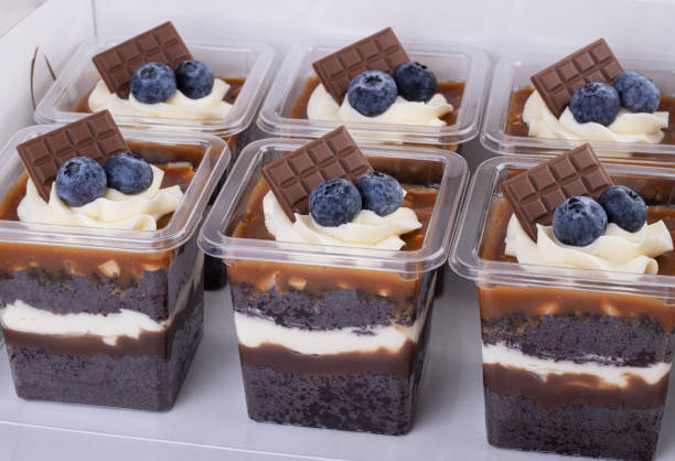 istock Chocolate-caramel cupcake with berries in a Cup 1297982550
