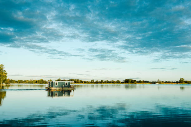 Vacations on houseboat in Germany Houseboat on lake in Germany, Summer vacations brandenburg state stock pictures, royalty-free photos & images