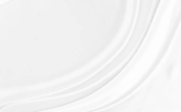 istock White gray satin texture that is white silver fabric silk background with beautiful soft blur pattern natural. 1297982822