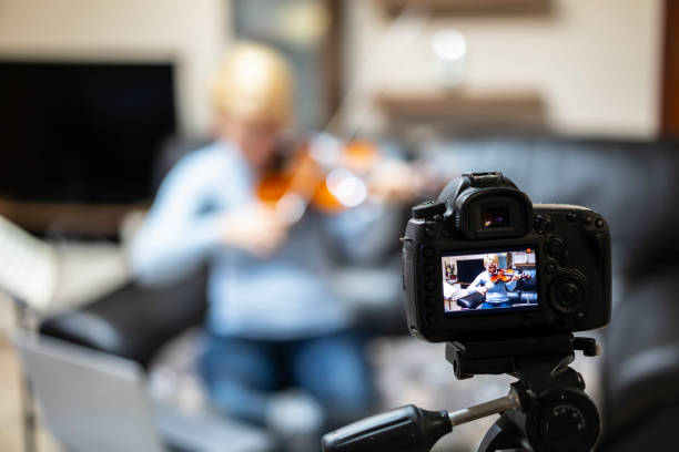 istock Violinist recordning a vlog 1297983824