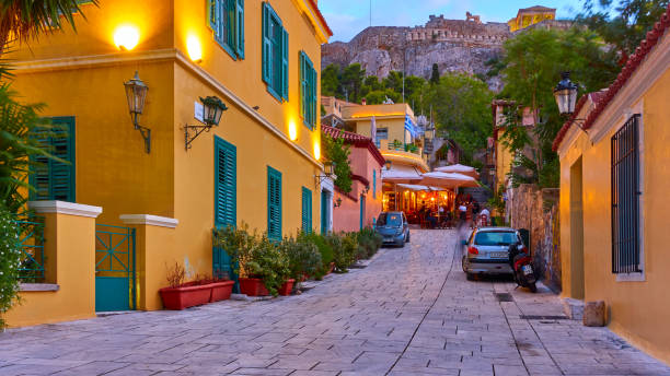 Athens,  Greece - September 20, 2019: A street in Plaka district on the slope of The Acropolis hill in Athens at dusk Athens,  Greece - September 20, 2019: A street in Plaka district on the slope of The Acropolis hill in Athens at dusk plaka athens stock pictures, royalty-free photos & images