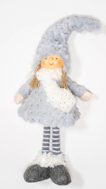 istock Close up of cute doll on white background. Decorative attractive puppet with copyspace for your text 1297986678