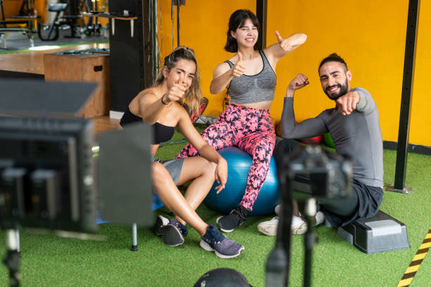 istock Group of friends recording video tutorial at the gym 1297986859