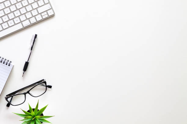 istock White desk with copy space. Home office. View from above. Business desk. 1297990260