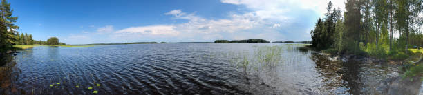 istock Finland forest lake boat fishing 1297990807