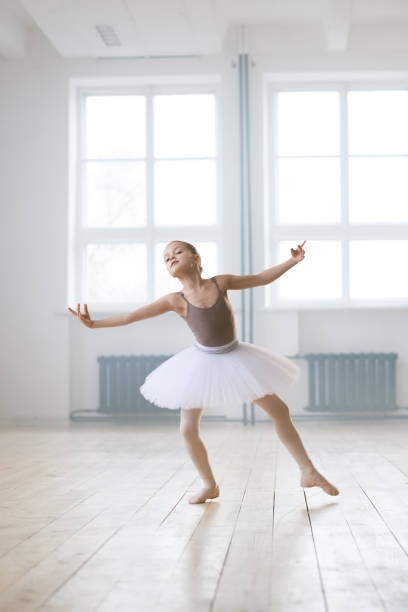 istock Little ballerina dancing 1297995451