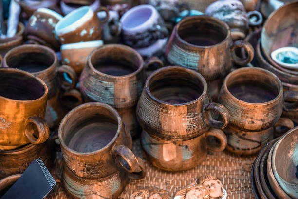 Clay dishes. Crockery made of clay. Ceramic national Ukrainian dishes made in the Poltava region in the village of Opishnya and demonstrated at the in Velyki Sorochyntsi Fair. Burnt black ceramics