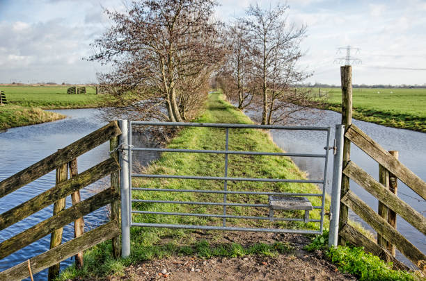 istock Climbable fence on a hiking trail 1297996556