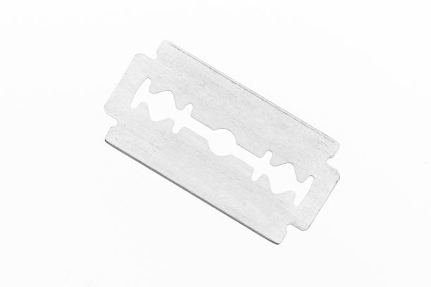 istock Traditional steel razor blade isolated on white 1297996701