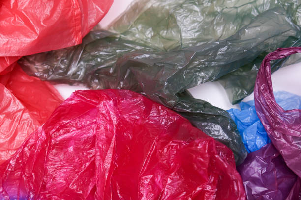 istock Plastic bags waste on white background, plastic recycling concept 1297996809