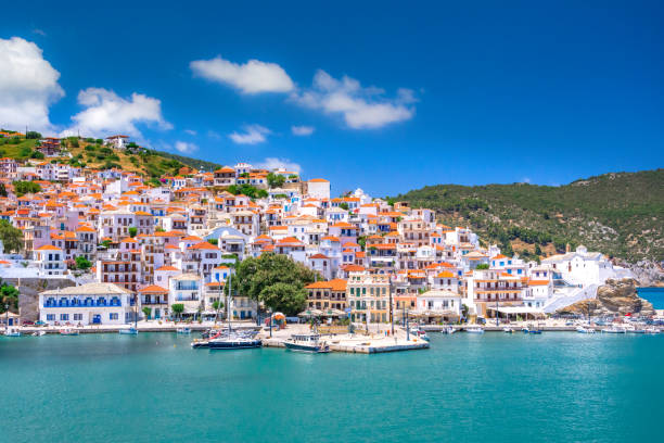 View of town and port at the island Skopelos, northern Sporades, Greece View of town and port at the island Skopelos, northern Sporades, Greece aegean islands photos stock pictures, royalty-free photos & images