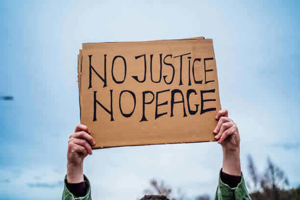 istock Man hand holding placard with text 