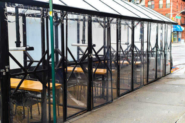 istock Sidewalk Restaurant Dining w/ Heat Lamps 1298003485