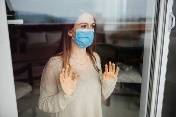 istock Woman in isolation at home for virus outbreak 1298004016