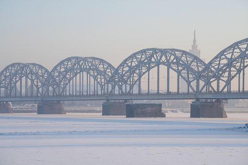 The railway riveted bridge across Daugava river in Riga, Latvia.
