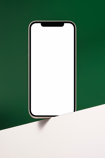Blank white screen smart phone mockup, template with clipping path on green and white background.