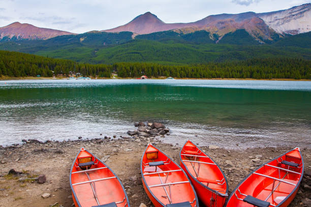 istock Red canoes are dried on the shore 1298009918
