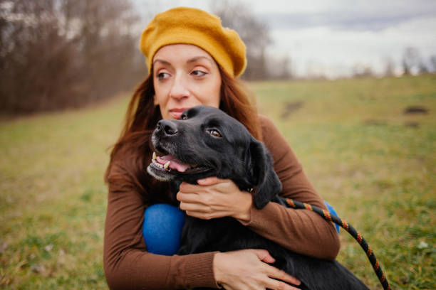 istock Woman with labrador 1298011359