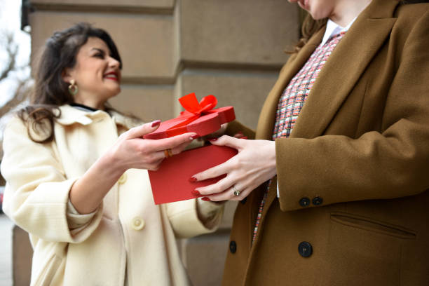 istock Cropped shot beautiful women with present 1298013982