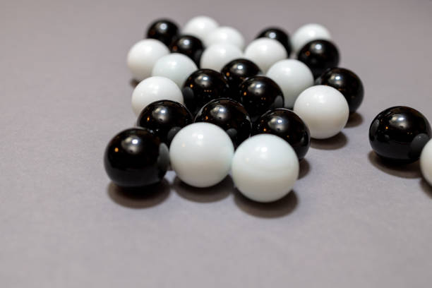 istock group of black and white balls on a gray surface 1298015113