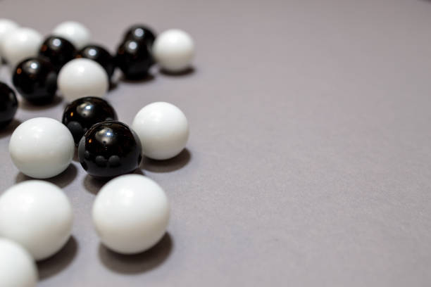 istock black and white balls on a gray surface copy space 1298015815